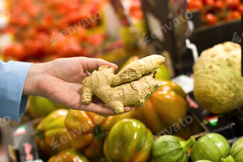 Preview: Women Hand Choosing Ginger At Supermarket