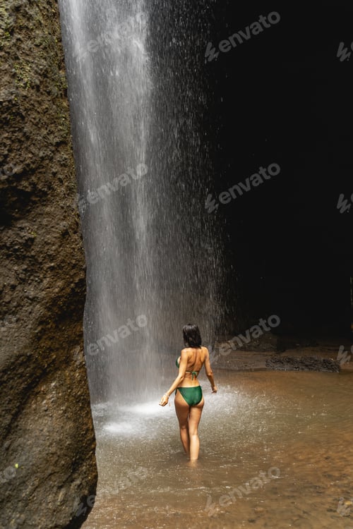 Preview: Young brunette woman being inside of cave