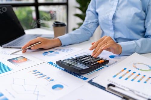 Preview: Asian business ideas are thinking and calculating with a calculator. front view of hand pointing to