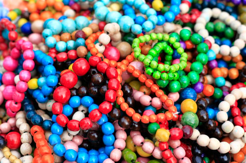 Preview: Colorful handmade wooden bracelets, close-up background