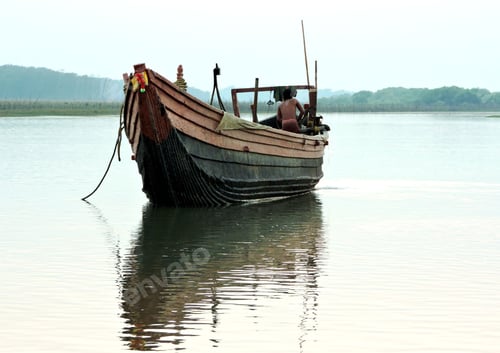 Preview: Closeup of an old canoe on the lake