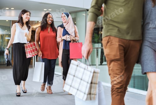 Preview: Group of friends shopping in a mall