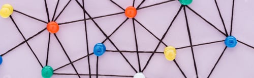 Preview: panoramic shot of colorful push pins connected with strings Isolated On pink, network concept
