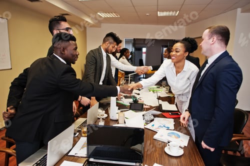 Preview: Multiracial young creative people in modern office
