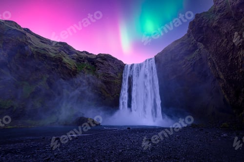 Preview: Aurora Borealis over famous Skogafoss waterfall on Skoga river