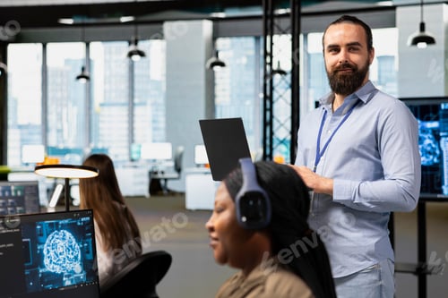 Preview: Portrait of team leader supervising programmers at work training AI
