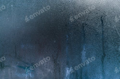 Preview: drops of water on wet glass.