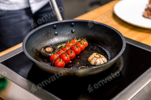 Preview: cropped image of chef frying vegetables