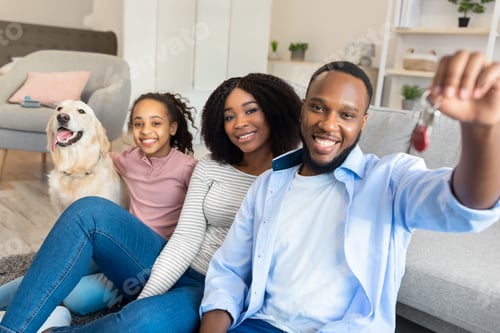 Preview: Happy African American family showing keys of their new apartment
