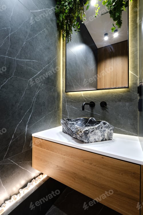 Preview: Stylish bathroom design featuring stone sink and modern lighting in urban setting