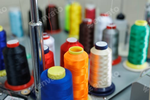 Preview: Set of multi colored threads of modern electronic professional embroidery machine.