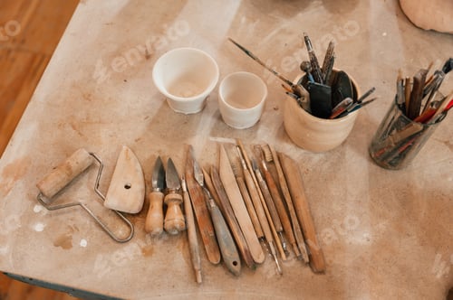 Preview: Pottery tools. Close up view of the table with instruments