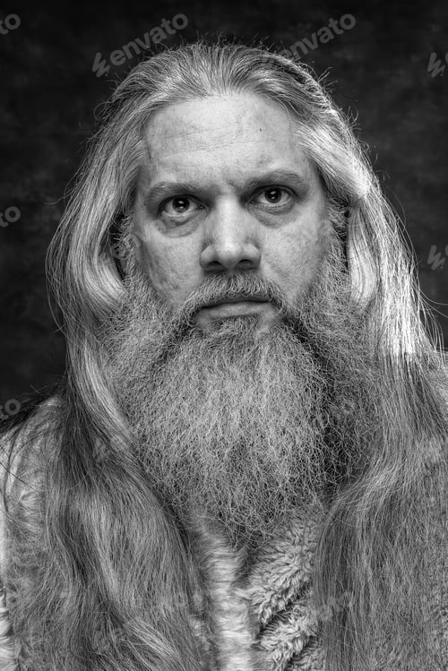 Preview: Self-portrait of bearded man with intense gaze straight ahead.