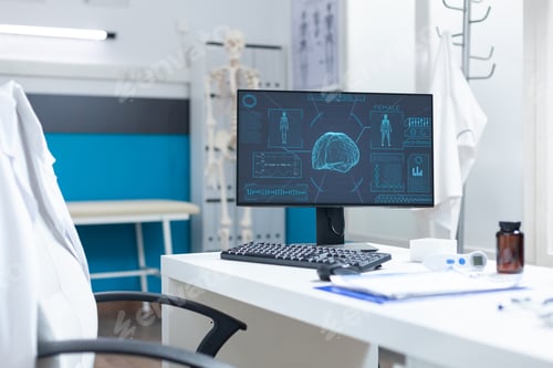 Preview: Computer standing on desk in empty bright clinical office having body radiography