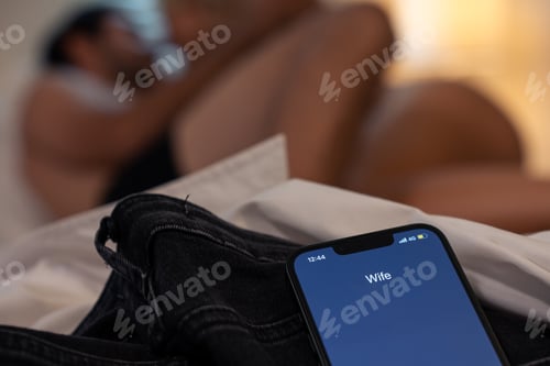 Preview: Close up of mobile phone, Wife calling cheating husband at night time.