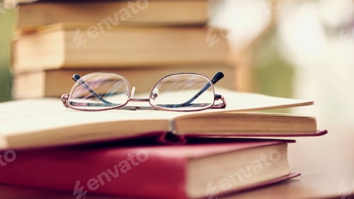 Preview: pile of old books lie on the table. home library. concept of vacation from gadgets in nature