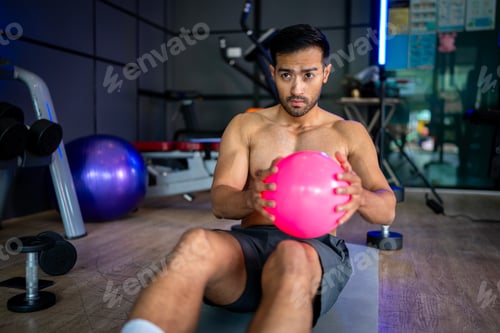 Preview: A strong Asian man is exercising to build muscle.