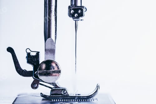 Preview: Sewing machine needle isolated on white.