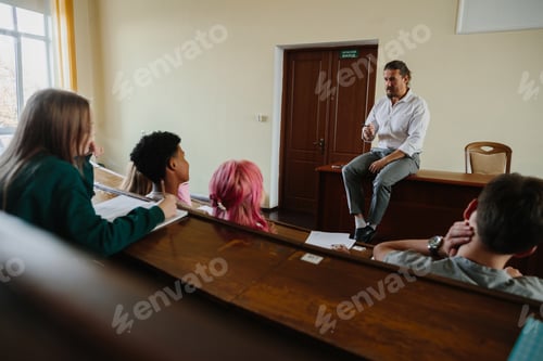 Preview: Teacher Engaging With Students in a Classrooom Setting Discussion