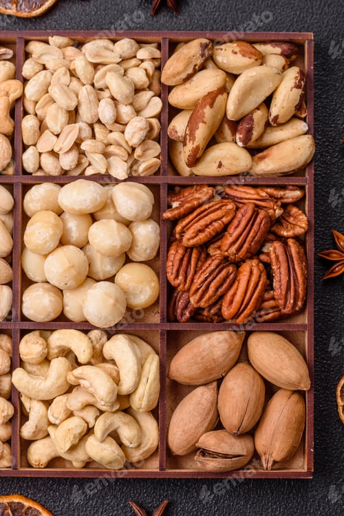 Preview: Box with various nuts cashew, macadamia, peanut, cedar, pecan, walnut, brazil, hazelnut
