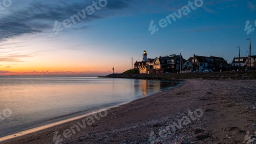 Preview: Urk Flevoland Netherlands sunset at the lighthouse and harbor of Urk Holland
