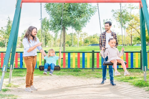 Preview: A gay couple playing with their children on the swing