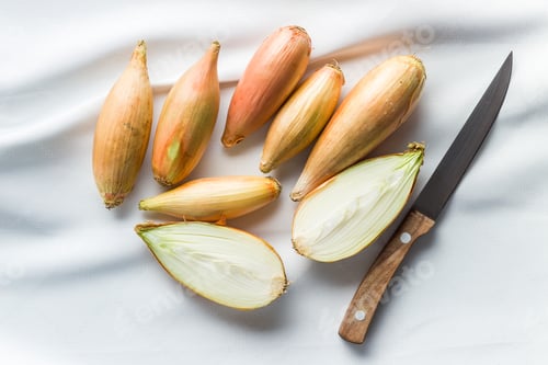 Preview: The golden shallot onion. Halved fresh bulbs