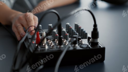 Preview: Hand Adjusting Audio Mixer in Recording Studio