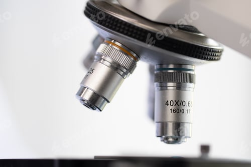 Preview: Scientist analyzing microscope slide at laboratory, technician examining a histological sample