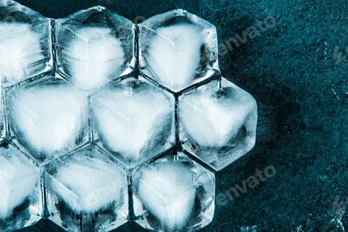 Preview: Honeycomb ice cubes on the dark stone table