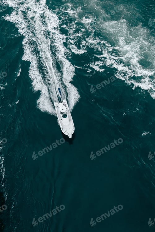 Boat Cutting Through Blue Ocean Waters