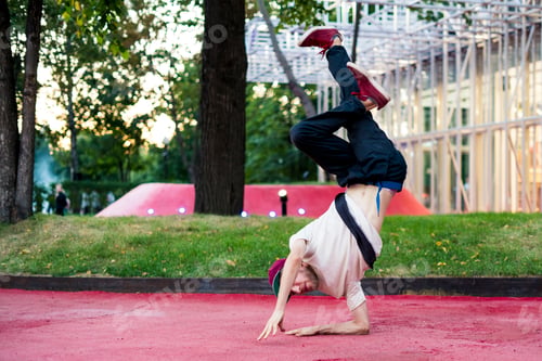 Preview: young man urban subculture hip hop dance in the city park
