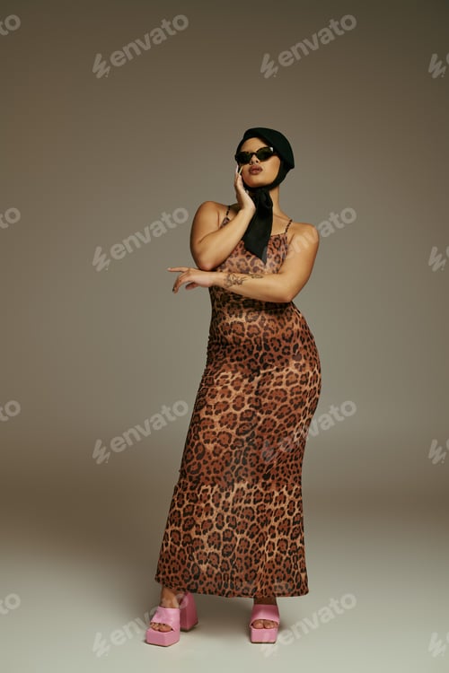 Preview: Stylish young woman confidently posing in a leopard print dress and striking platform shoes