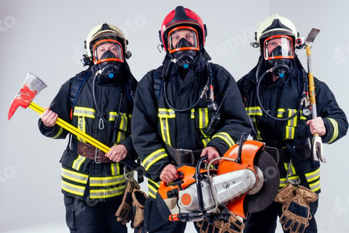 Preview: Portrait of three firefighters standing together white background studio