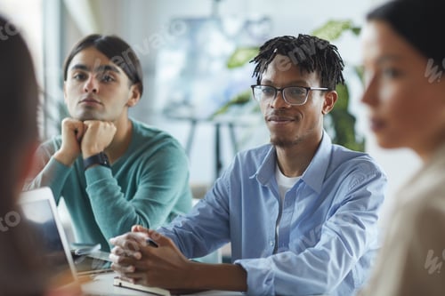 Preview: Businessman sitting at meeting