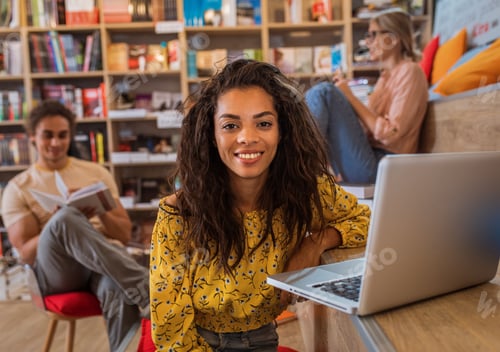 Preview: Portrait of young African American female student study in the library.