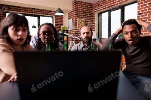 Preview: Shocked multiethnic friends watching tragic news on laptop computer at home.