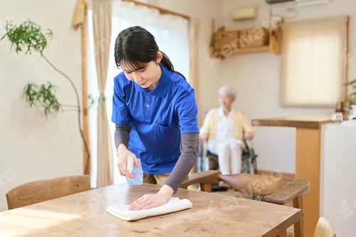 Preview: Asian caregiver cleaning during home visit care
