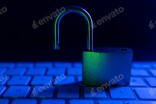 Preview: Lock and keyboard in the dark with light reflecting off the metal surface