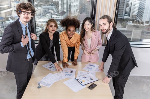 Preview: Diverse colleagues gather in brainstorm discuss statistics together.