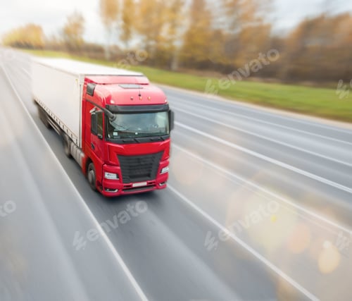 Preview: Red heavy truck driving on the highway