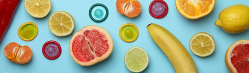 Preview: Sex concept with fruits and condoms on blue background