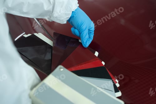 Preview: Car painter chooses auto body color with samples