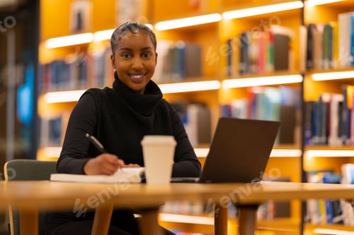 Preview: Student studying in modern library