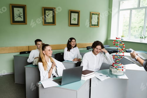 Preview: Teacher explains biology lesson using DNA model to pupils