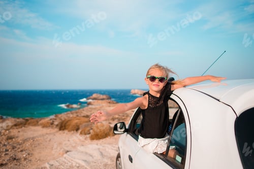 Preview: Little girl on vacation travel by car background beautiful landscape