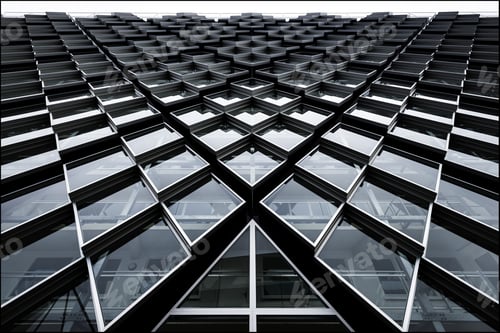 Preview: Low angle shot of a modern building with abstractly shaped windows