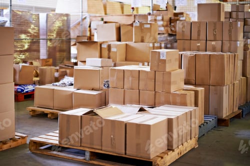 Preview: Pallets ready to go. Shot of stacked boxes in a large distribution warehouse.