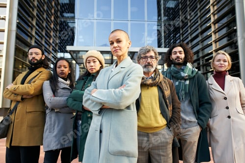 Preview: A group of business people from a company led by an empowered woman. Looking at camera