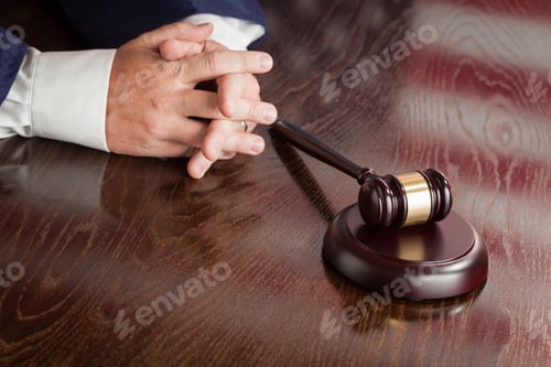 Preview: Judge Rests Hands Behind Gavel with American Flag Table Reflection